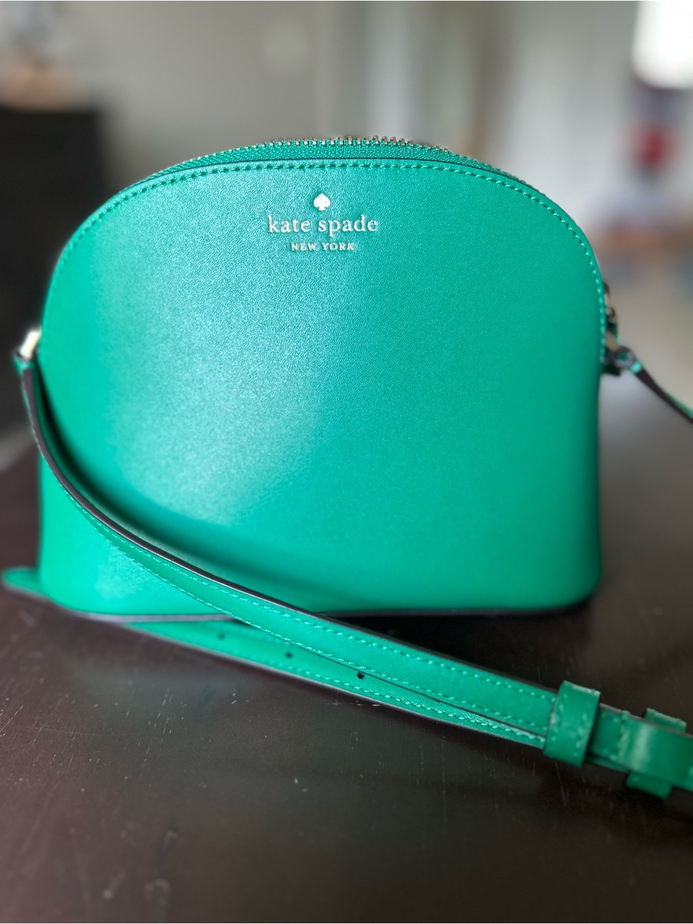 kate spade emerald green dome crossbody with gold logo